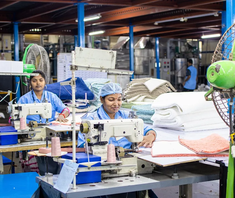 Garment production line with sewing machine operators in South Asia